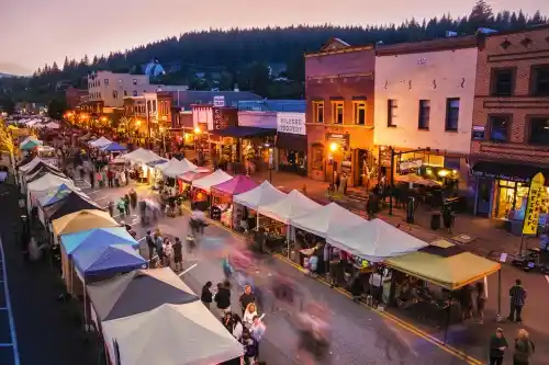 Image of downtown Truckee California. You can see market stands. It appears to be a farmers market.
